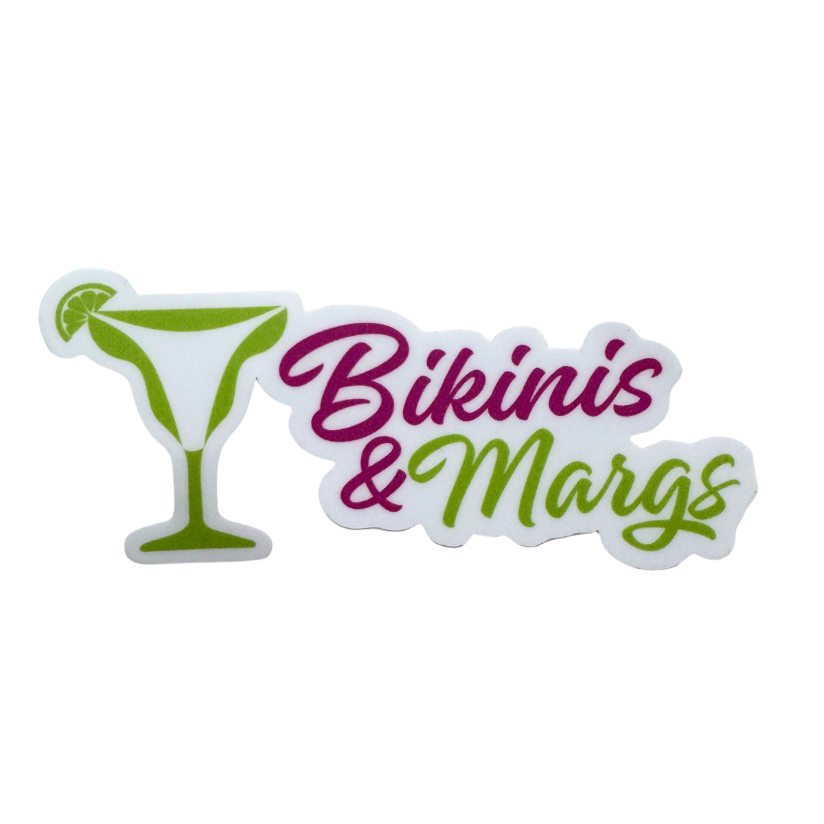 A die-cut sticker featuring a green martini glass with a lime wedge on the left and the words 'Bikinis & Margs' in stylized pink and green script on a white background.
